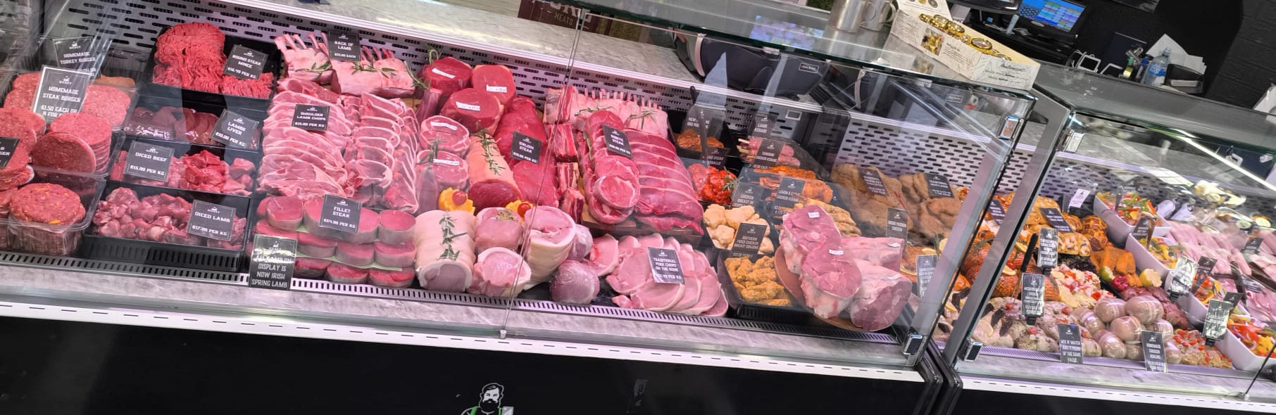 Hickey's Fresh meat display case with various cuts of meat in their local westend butcher store.